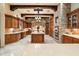 Gourmet kitchen featuring an oversized island, brick accents, and professional appliances at 6402 E Chaparral Rd, Paradise Valley, AZ 85253