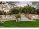 Picturesque landscaping with stone steps, lush greenery, and mountain views, creating a peaceful and inviting outdoor space at 6402 E Chaparral Rd, Paradise Valley, AZ 85253