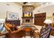 Cozy living room features a stone fireplace, custom built-ins, and comfortable furniture at 6402 E Chaparral Rd, Paradise Valley, AZ 85253
