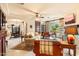 Comfortable living room with fireplace, natural light, and seamless flow to the dining area at 6402 E Chaparral Rd, Paradise Valley, AZ 85253