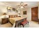 Tranquil main bedroom with ceiling fan, neutral tones, and access to a private ensuite bathroom at 6402 E Chaparral Rd, Paradise Valley, AZ 85253