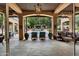 Covered outdoor patio offering a view of the swimming pool and landscaped backyard, perfect for relaxing at 6402 E Chaparral Rd, Paradise Valley, AZ 85253