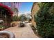 Relaxing patio features dining area, seating, beautiful planters, and manicured foliage at 6402 E Chaparral Rd, Paradise Valley, AZ 85253