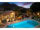 Inviting pool with surrounding patio, landscaping, and mountain views, perfect for outdoor relaxation and entertainment at 6402 E Chaparral Rd, Paradise Valley, AZ 85253