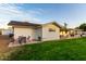 A quaint backyard featuring a cozy patio space, perfect for outdoor dining and relaxation with lush green grass at 6718 N 19Th Pl, Phoenix, AZ 85016