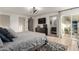 Spacious main bedroom with sliding door to the patio, en suite bathroom, and modern decor at 6718 N 19Th Pl, Phoenix, AZ 85016