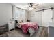 Comfortable bedroom with colorful accents, a cozy bed, and a sliding barn door for a touch of rustic charm at 6718 N 19Th Pl, Phoenix, AZ 85016