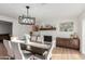 Inviting dining space with modern lighting and a cozy fireplace at 6718 N 19Th Pl, Phoenix, AZ 85016