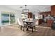 Bright dining room with a modern chandelier and a sliding door to the backyard at 6718 N 19Th Pl, Phoenix, AZ 85016