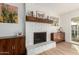Cozy living room with a white brick fireplace and decorative mantel at 6718 N 19Th Pl, Phoenix, AZ 85016