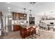 Open concept kitchen boasts a central island, updated appliances, and adjoins a dining area and a living area at 6718 N 19Th Pl, Phoenix, AZ 85016