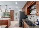 View of the kitchen featuring granite countertops, stainless steel appliances, and wood cabinetry at 6718 N 19Th Pl, Phoenix, AZ 85016