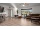Spacious living room featuring a large sectional sofa, hardwood floors and bright lighting at 6718 N 19Th Pl, Phoenix, AZ 85016