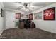 This home office is equipped with a ceiling fan, a window, sports memorabilia, and a computer setup at 6718 N 19Th Pl, Phoenix, AZ 85016