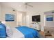 Cozy bedroom with a soothing blue comforter, a TV, and calming artwork at 7401 W Arrowhead Clubhouse Dr # 1006, Glendale, AZ 85308
