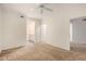 Spacious bedroom with neutral walls and a comfortable carpet, leading to the bathroom and closet at 7401 W Arrowhead Clubhouse Dr # 1006, Glendale, AZ 85308
