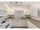 Well-maintained kitchen featuring white appliances and ample countertop space for meal preparation at 7401 W Arrowhead Clubhouse Dr # 1006, Glendale, AZ 85308