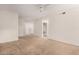 Expansive living area featuring neutral carpet, recessed lighting, and multiple doorways at 7401 W Arrowhead Clubhouse Dr # 1006, Glendale, AZ 85308