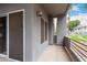 The patio features gray concrete walls and a railing with views of the community and pool at 7401 W Arrowhead Clubhouse Dr # 1006, Glendale, AZ 85308