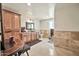 Spacious bathroom features tile flooring, wood cabinets, and an elegant vanity at 902 W Moon Valley Dr, Phoenix, AZ 85023
