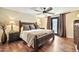 Charming bedroom featuring a decorative wood bed frame and door to the outside at 902 W Moon Valley Dr, Phoenix, AZ 85023