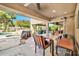 Relaxing covered patio with dining area, outdoor grill, ceiling fan, and views of the pool at 902 W Moon Valley Dr, Phoenix, AZ 85023