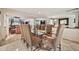 Spacious dining room with elegant chairs and an adjacent living area at 902 W Moon Valley Dr, Phoenix, AZ 85023