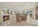 Open concept dining area with access to the entryway and a game room at 902 W Moon Valley Dr, Phoenix, AZ 85023