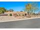 Spacious home with a Southwestern design, mature landscaping, a circular driveway, and a two-car garage at 902 W Moon Valley Dr, Phoenix, AZ 85023