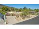 This property features desert landscaping with an expansive driveway, a two-car garage, and is situated on a corner lot at 902 W Moon Valley Dr, Phoenix, AZ 85023