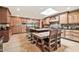 The bright kitchen features an expansive island with bar seating, high-end stainless appliances, and custom wood cabinetry at 902 W Moon Valley Dr, Phoenix, AZ 85023