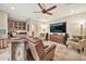 Comfortable living room featuring a wet bar, large screen TV, and relaxing armchairs at 902 W Moon Valley Dr, Phoenix, AZ 85023