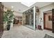Stunning home interior featuring a glass-enclosed wine cellar, marble floors, recessed lighting, and views into dining area at 902 W Moon Valley Dr, Phoenix, AZ 85023
