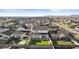 Aerial view showcases a home with a manicured backyard and neighborhood views at 10150 E Thistle Ave, Mesa, AZ 85212