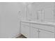 Modern bathroom features a double vanity with white cabinets and a large mirror at 10150 E Thistle Ave, Mesa, AZ 85212