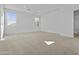Bright and spacious bedroom with plush carpeting and multiple windows allowing natural light at 10150 E Thistle Ave, Mesa, AZ 85212