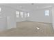 Bright and spacious bedroom with plush carpeting and multiple windows allowing natural light at 10150 E Thistle Ave, Mesa, AZ 85212