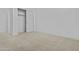 Bright, spacious bedroom with neutral carpet, walk-in closet, and fresh white walls at 10150 E Thistle Ave, Mesa, AZ 85212