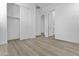 Clean bedroom boasts hard surface floors, white walls, and a closet at 10150 E Thistle Ave, Mesa, AZ 85212