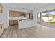 Bright kitchen with modern stainless steel appliances and an island, with an open view to the yard at 10150 E Thistle Ave, Mesa, AZ 85212