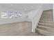 Bright open-concept living space with fresh paint, large windows, and sleek hard surface floors at 10150 E Thistle Ave, Mesa, AZ 85212