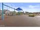 Community playground with colorful equipment and safety flooring at 10150 E Thistle Ave, Mesa, AZ 85212
