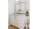 Bathroom featuring white vanity, granite counter, and silver framed mirror at 1021 S Greenfield Rd # 1106, Mesa, AZ 85206