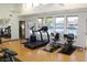 Well-equipped gym with treadmills, stationary bikes, mirrors, and ample natural light for a healthy workout at 1021 S Greenfield Rd # 1106, Mesa, AZ 85206