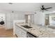 Modern kitchen with granite counters, stainless steel appliances, and white cabinetry at 1021 S Greenfield Rd # 1106, Mesa, AZ 85206
