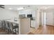 Modern kitchen with granite counters, stainless steel appliances, and adjacent breakfast bar seating at 1021 S Greenfield Rd # 1106, Mesa, AZ 85206