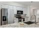 Bright kitchen featuring stainless steel appliances, granite counters, and modern fixtures at 1021 S Greenfield Rd # 1106, Mesa, AZ 85206