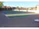 Outdoor tennis court with a well-maintained surface, surrounded by fencing in a sunny community setting at 1021 S Greenfield Rd # 1106, Mesa, AZ 85206