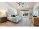 Comfortable bedroom with a ceiling fan, sliding glass door, and decorative pillows at 10634 E Cedar Waxwing Dr, Sun Lakes, AZ 85248