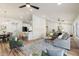 Open-concept interior featuring hardwood floors, combined living spaces, and high ceilings at 10634 E Cedar Waxwing Dr, Sun Lakes, AZ 85248